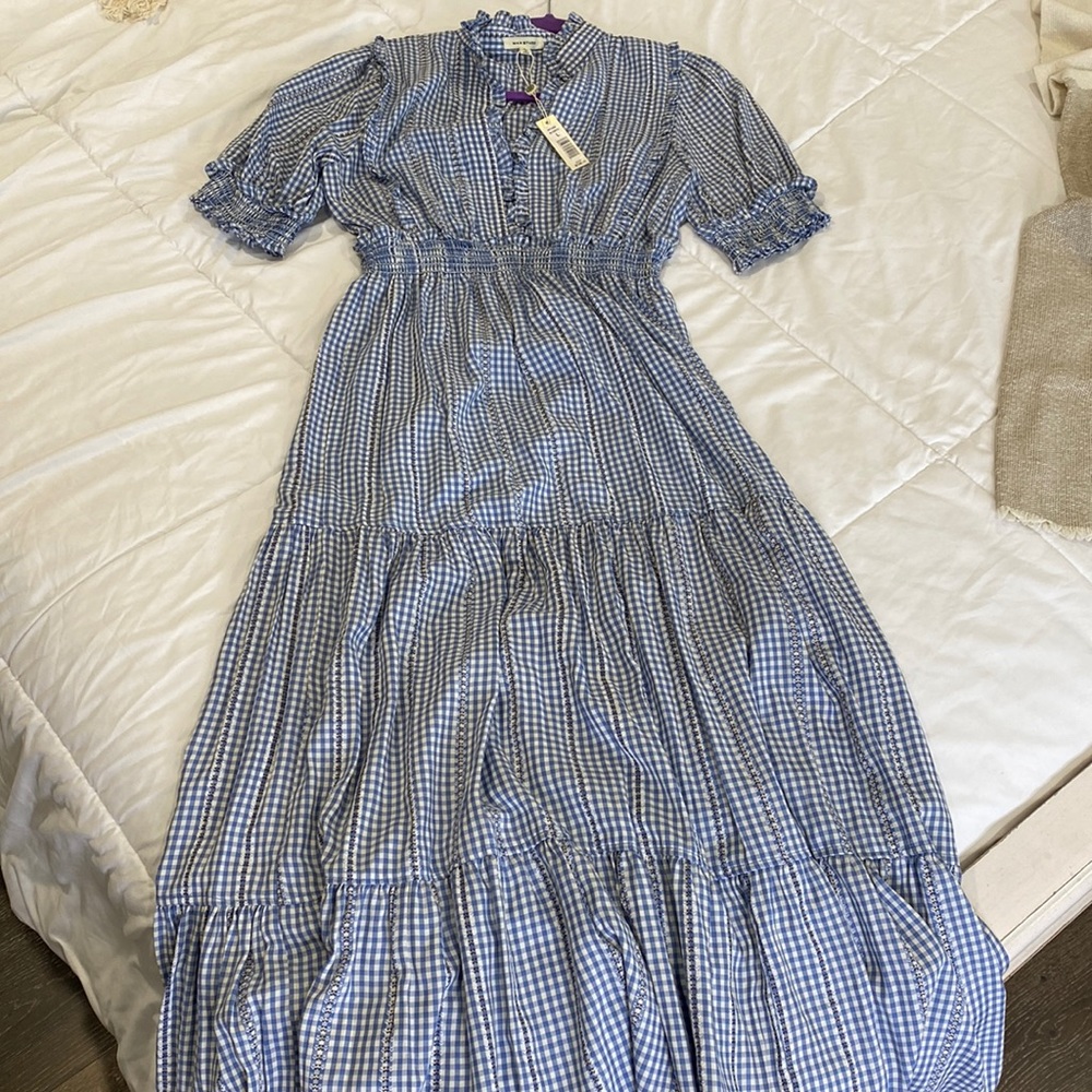 This dress has never been worn ! Great quality and price tag still on !